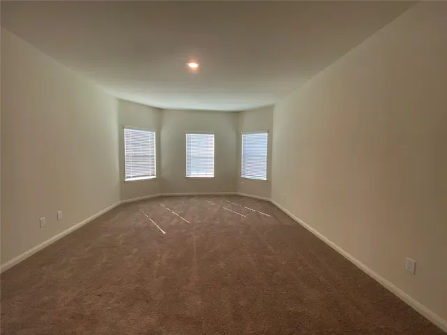 a view of empty room with windows