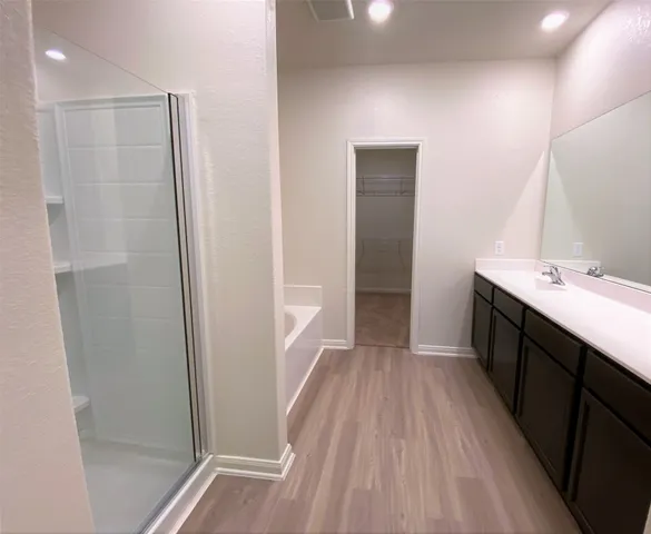 a kitchen with sink and refrigerator