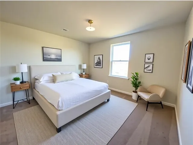 a bedroom with a bed and a couch
