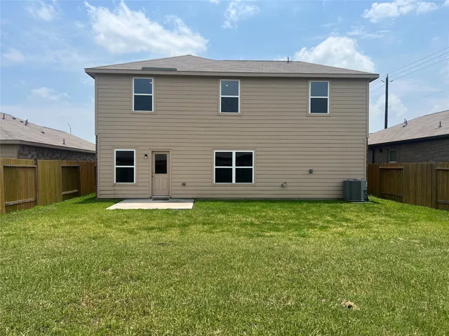 a backyard of a house with lots of green space