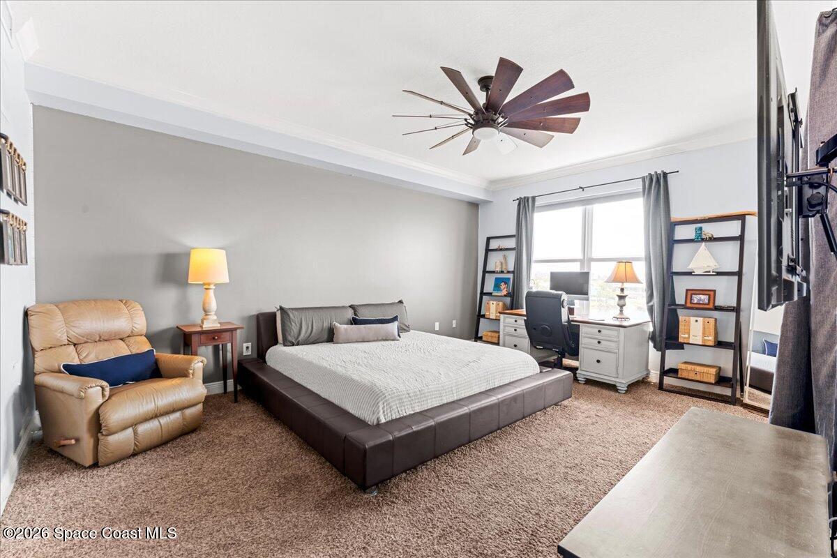 4125 West End Road, Unit 405 Cocoa Beach, FL 32931 - Photo 14 of 44 a spacious bedroom with a bed and window