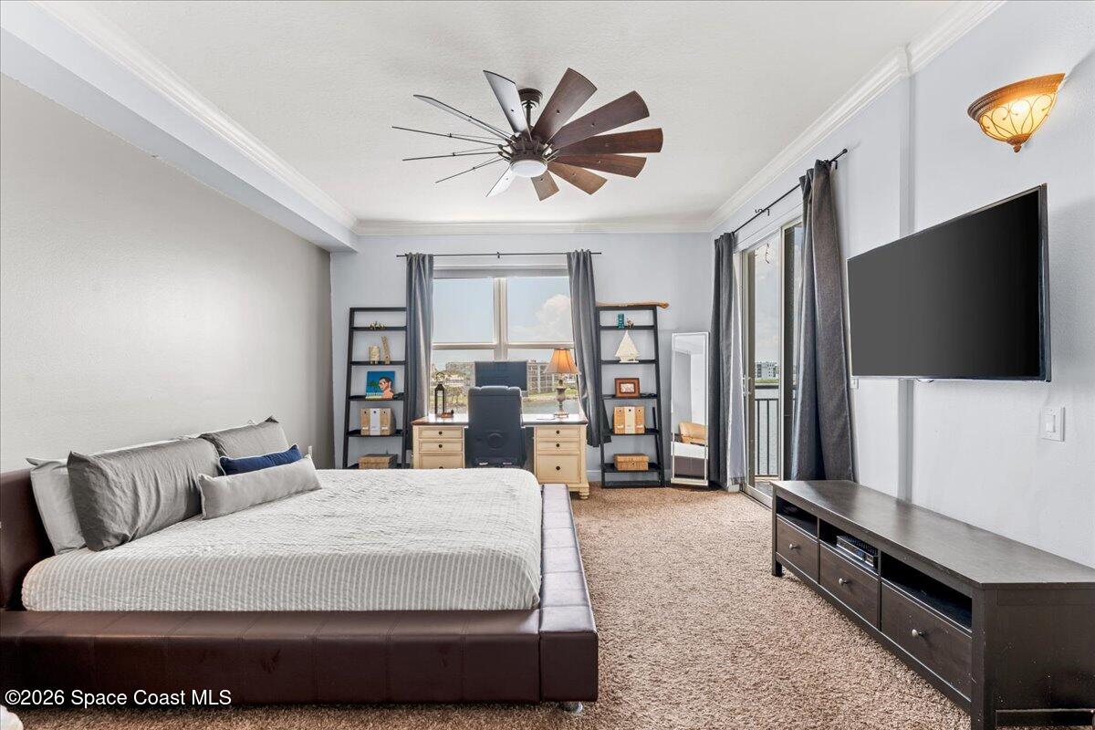 4125 West End Road, Unit 405 Cocoa Beach, FL 32931 - Photo 15 of 44 a living room with furniture and a flat screen tv