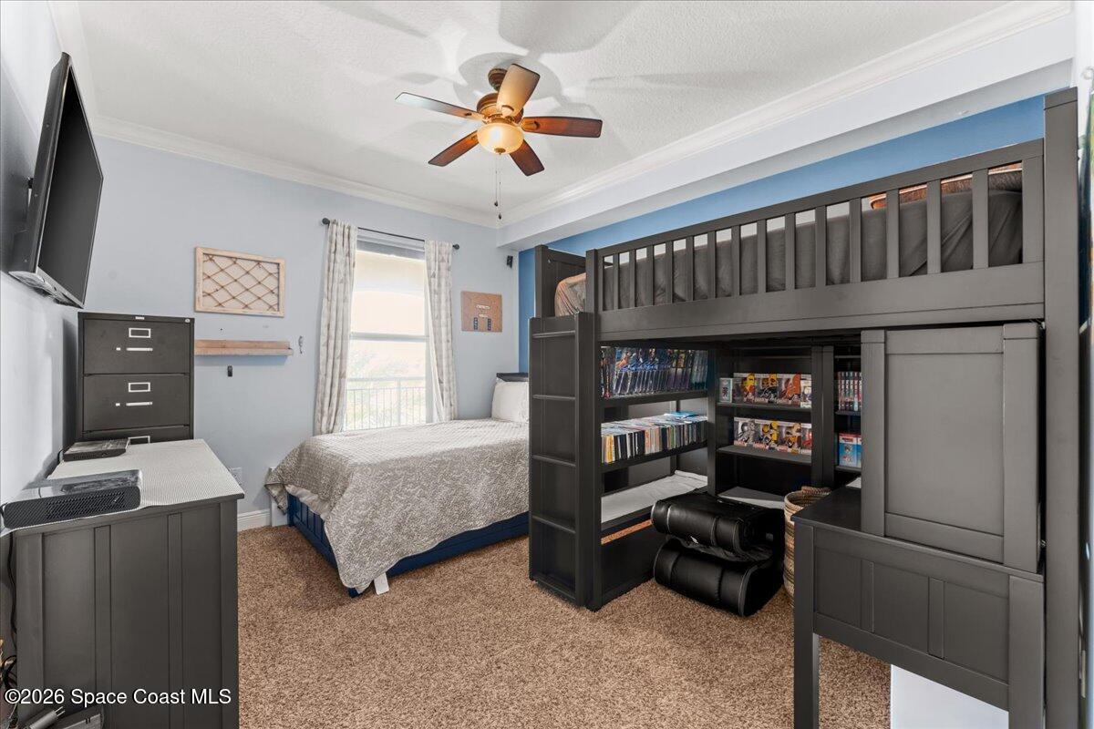 4125 West End Road, Unit 405 Cocoa Beach, FL 32931 - Photo 21 of 44 a bedroom with a bed furniture and a window