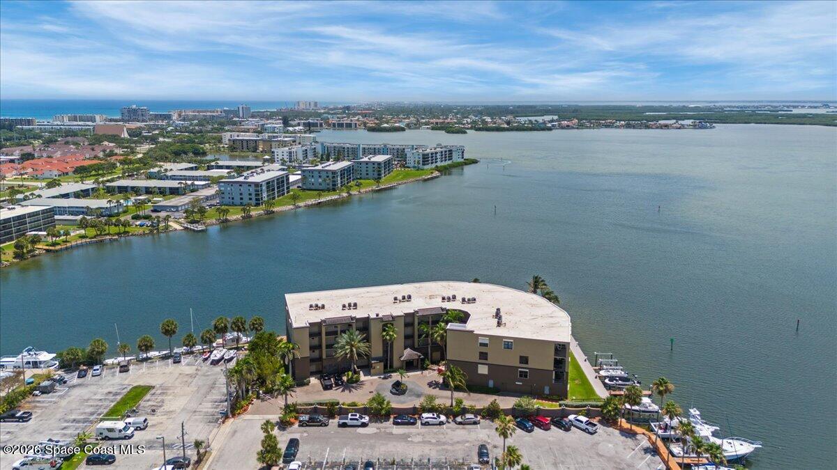 4125 West End Road, Unit 405 Cocoa Beach, FL 32931 - Photo 30 of 44 a view of a lake in middle of a town