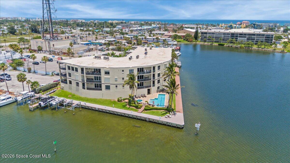 4125 West End Road, Unit 405 Cocoa Beach, FL 32931 - Photo 33 of 44 a view of a city with tall buildings