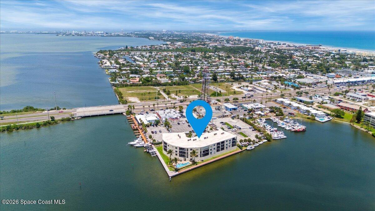 4125 West End Road, Unit 405 Cocoa Beach, FL 32931 - Photo 35 of 44 a view of a lake with a nearby beach
