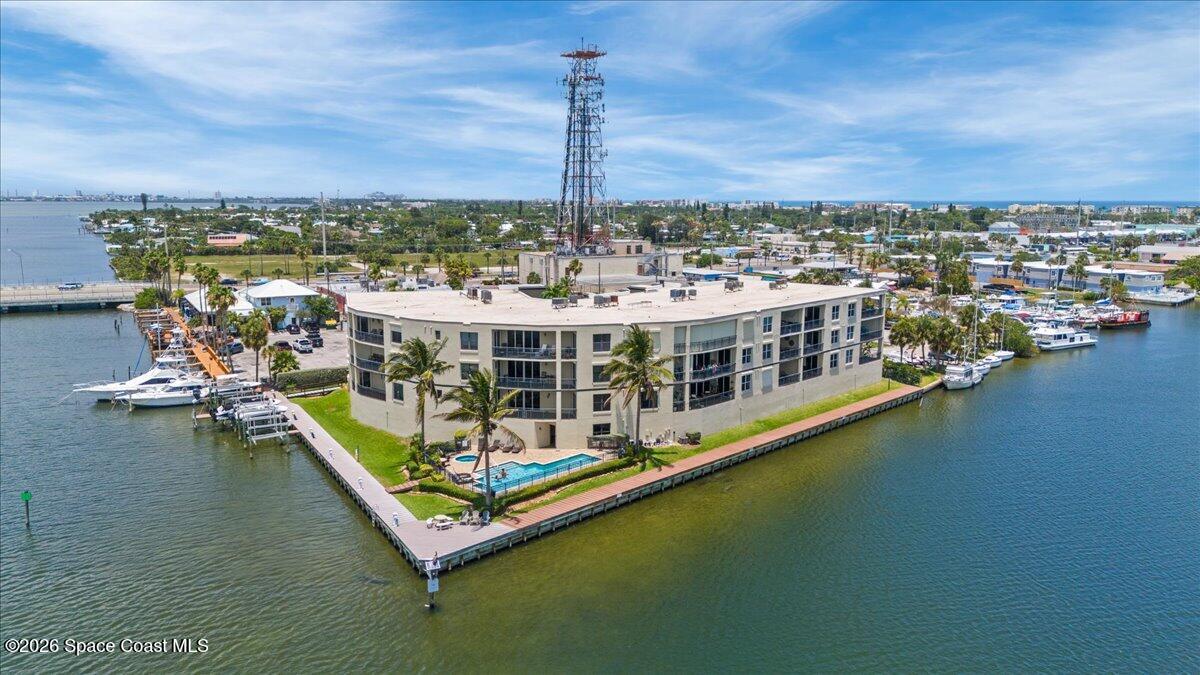4125 West End Road, Unit 405 Cocoa Beach, FL 32931 - Photo 36 of 44 a view of a lake with tall buildings