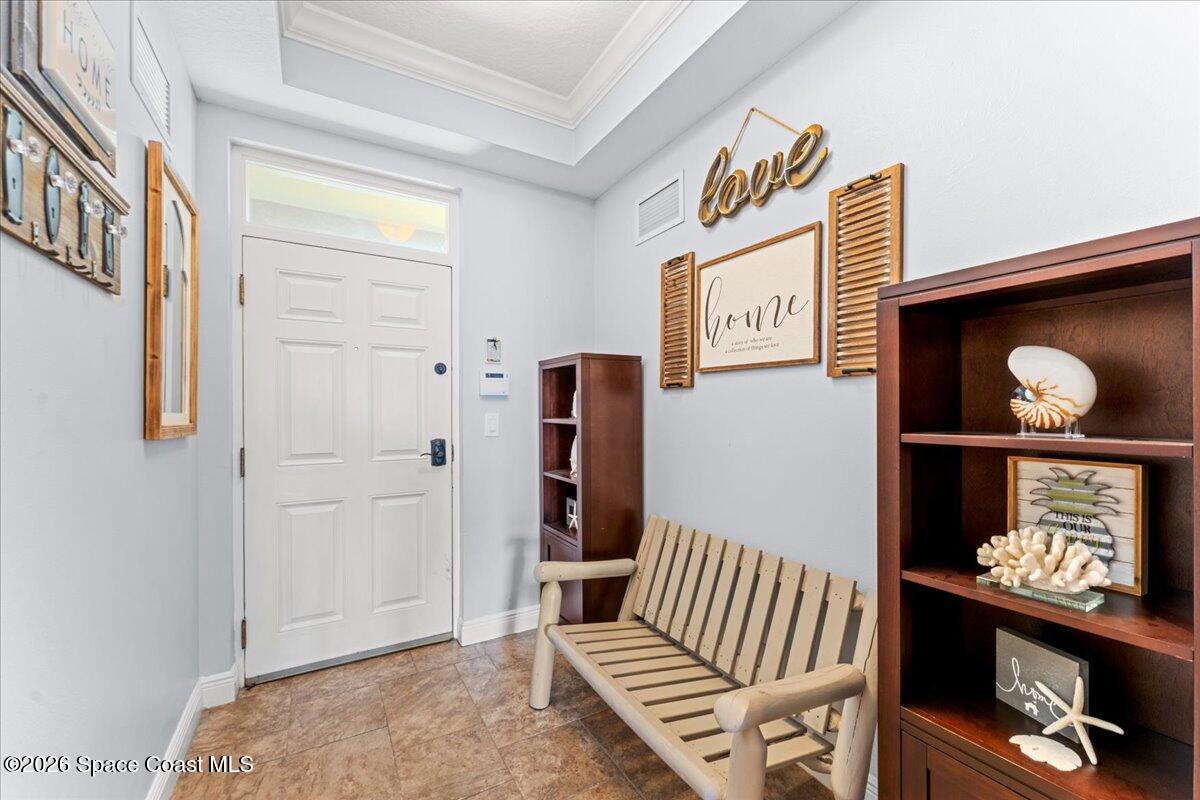 4125 West End Road, Unit 405 Cocoa Beach, FL 32931 - Photo 4 of 44 a view of an entryway with stairs