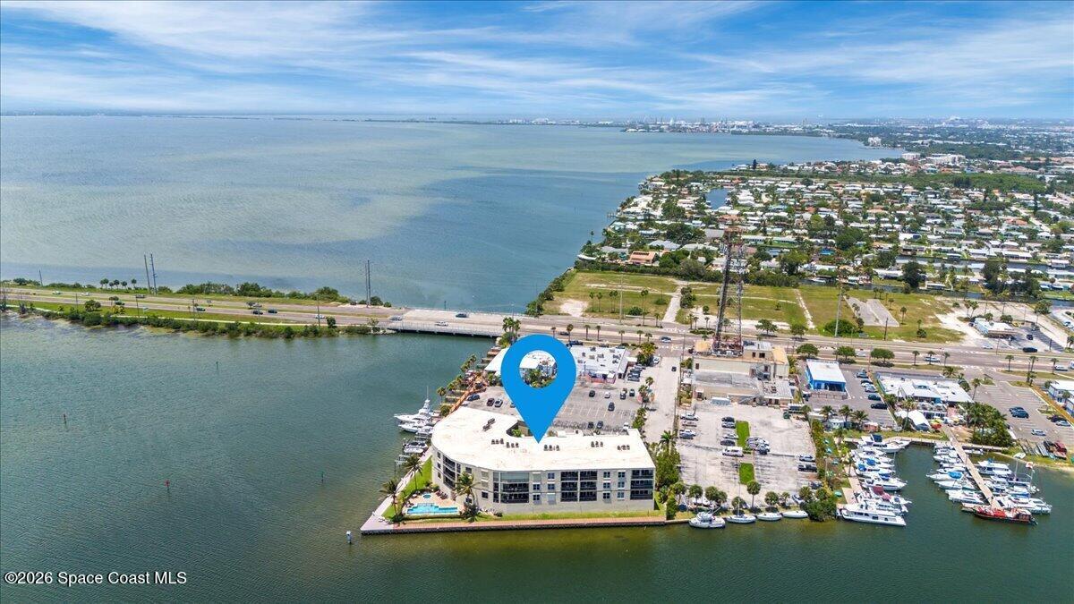 4125 West End Road, Unit 405 Cocoa Beach, FL 32931 - Photo 40 of 44 a view of a lake with a city