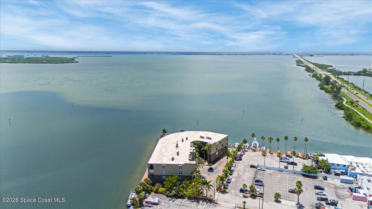 4125 West End Road, Unit 405 Cocoa Beach, FL 32931 - Photo 42 of 44 an aerial view of a houses with outdoor space