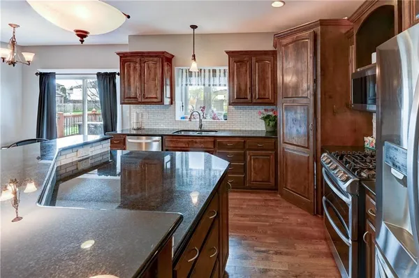 $610,000 | 500 Northeast Woodpark Lane, Lee's Summit, MO 64086