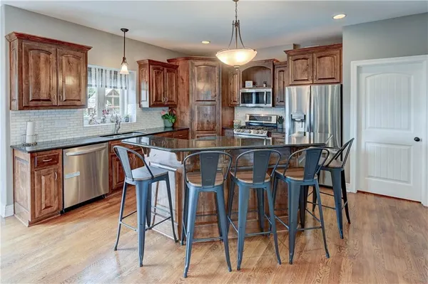 $610,000 | 500 Northeast Woodpark Lane, Lee's Summit, MO 64086