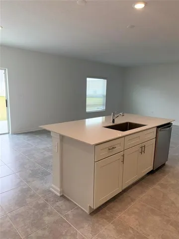 a kitchen with cabinets and sink