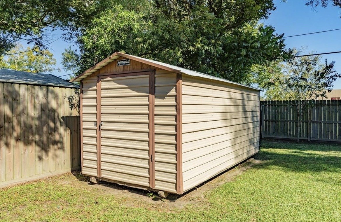 820 Perry Street Angleton, TX 77515 - Photo 8 of 26 a view of a back yard of the house