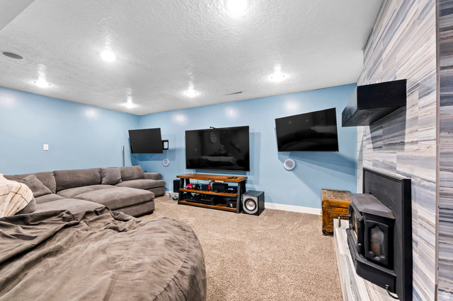 141 North 600 East Mapleton, UT 84664 - Photo 26 of 44 Carpeted living area featuring baseboards and a textured ceiling