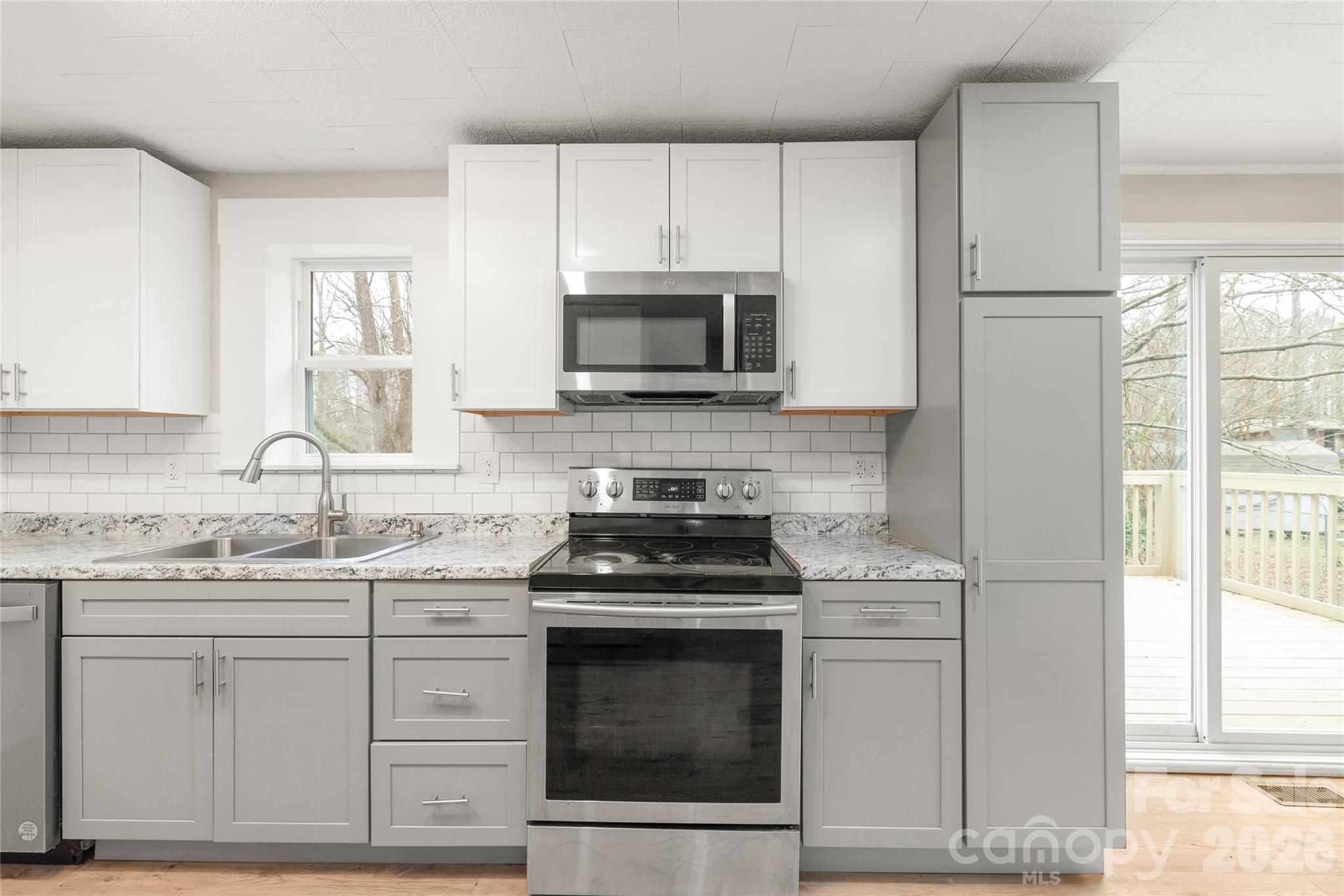 321 South Myrtle School Road Gastonia, NC 28052 - Photo 14 of 34 a kitchen with cabinets stainless steel appliances and window