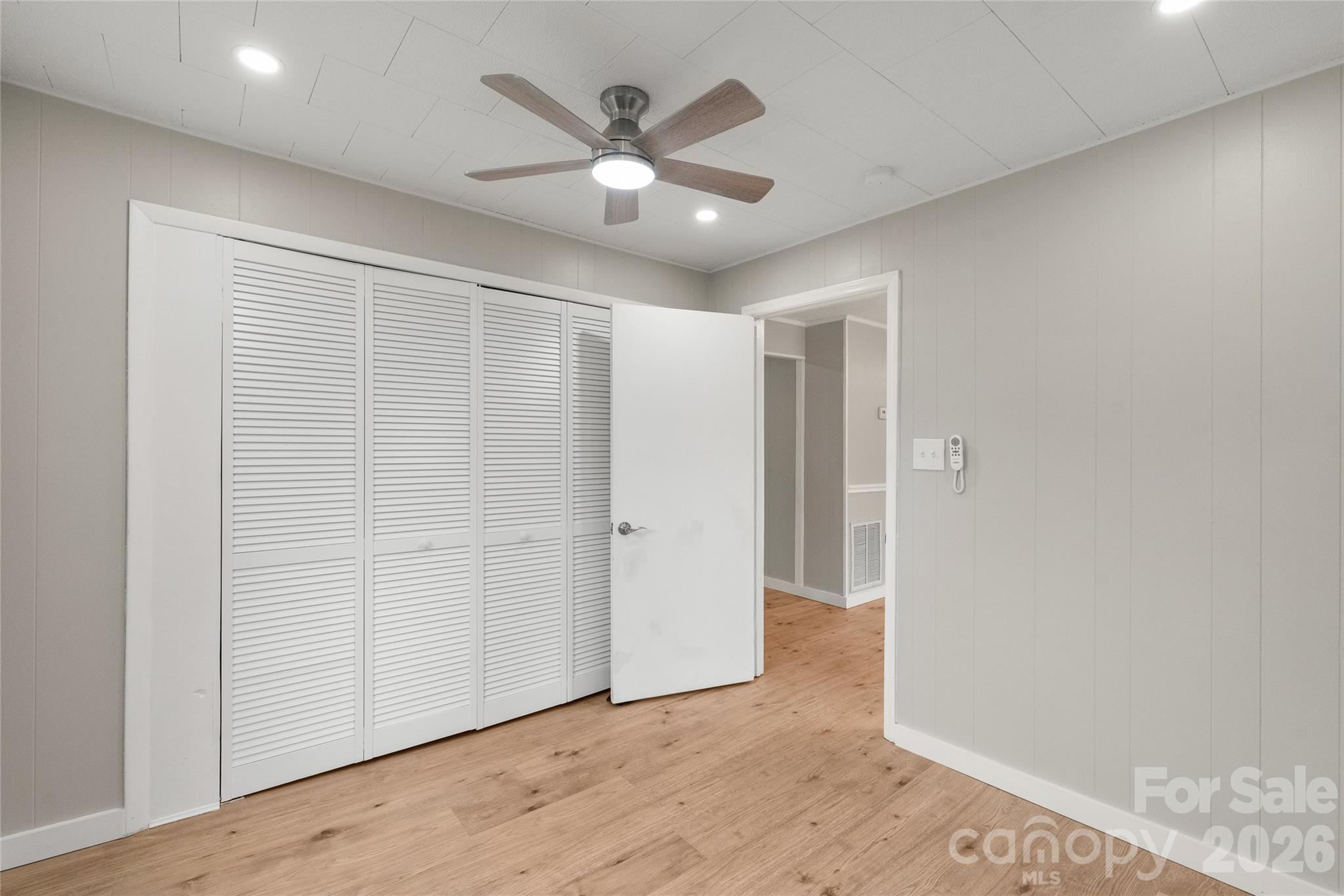 321 South Myrtle School Road Gastonia, NC 28052 - Photo 19 of 34 an empty room with wooden floor and ceiling fan