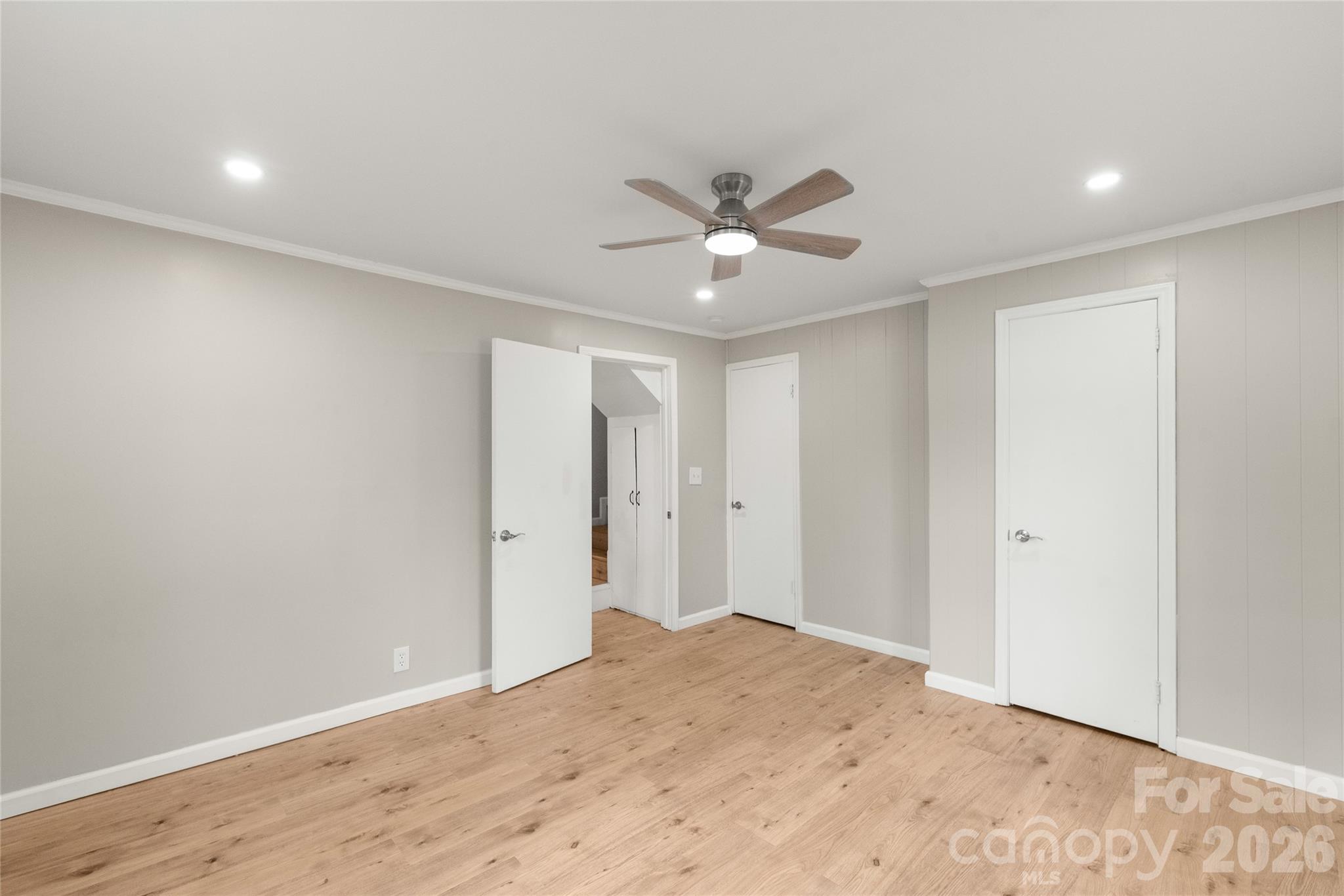 321 South Myrtle School Road Gastonia, NC 28052 - Photo 21 of 34 a view of a big room with wooden floor and a chandelier fan