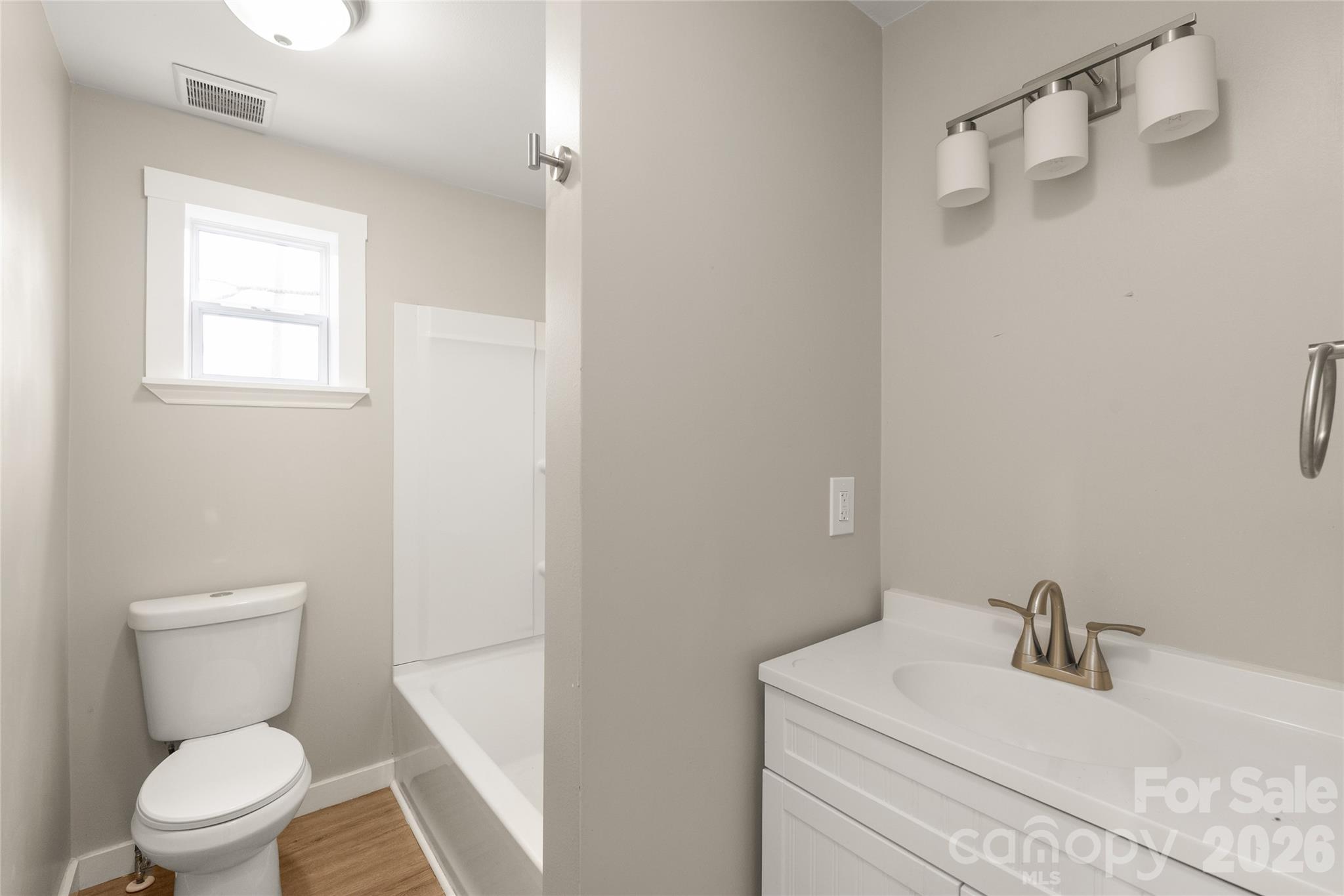 321 South Myrtle School Road Gastonia, NC 28052 - Photo 22 of 34 a white toilet sitting next to a bathroom sink