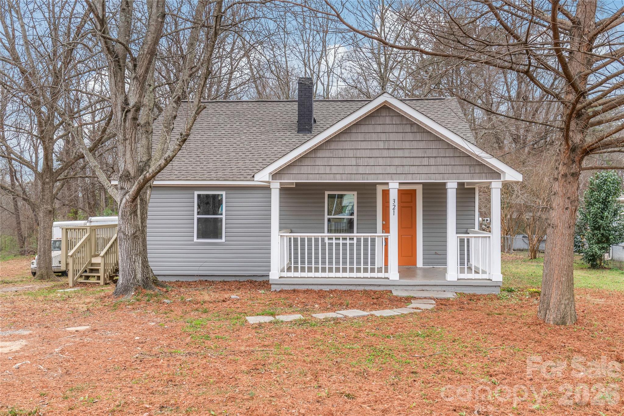 321 South Myrtle School Road Gastonia, NC 28052 - Photo 33 of 34 a house with trees in the background