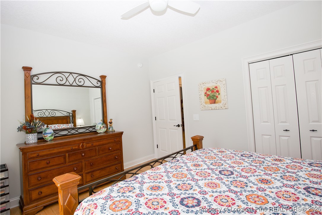 775 Connell Road Carthage, NC 28327 - Photo 17 of 50 a bedroom with a bed and a dresser in it