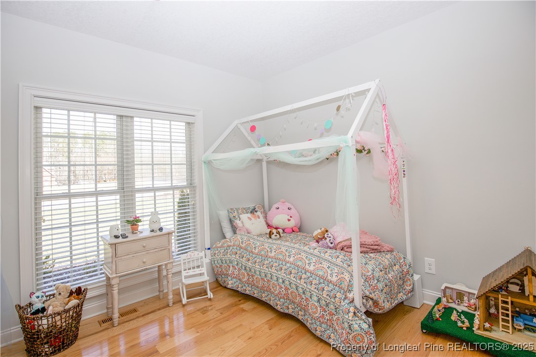 775 Connell Road Carthage, NC 28327 - Photo 18 of 50 a bedroom with a bed and a window