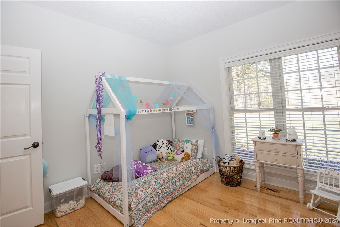 775 Connell Road Carthage, NC 28327 - Photo 19 of 50 a bedroom with furniture and a window