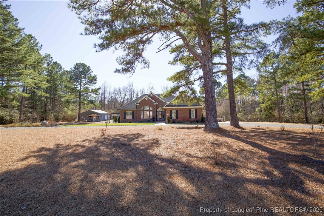 775 Connell Road Carthage, NC 28327 - Photo 2 of 50 a street view covered with tall trees