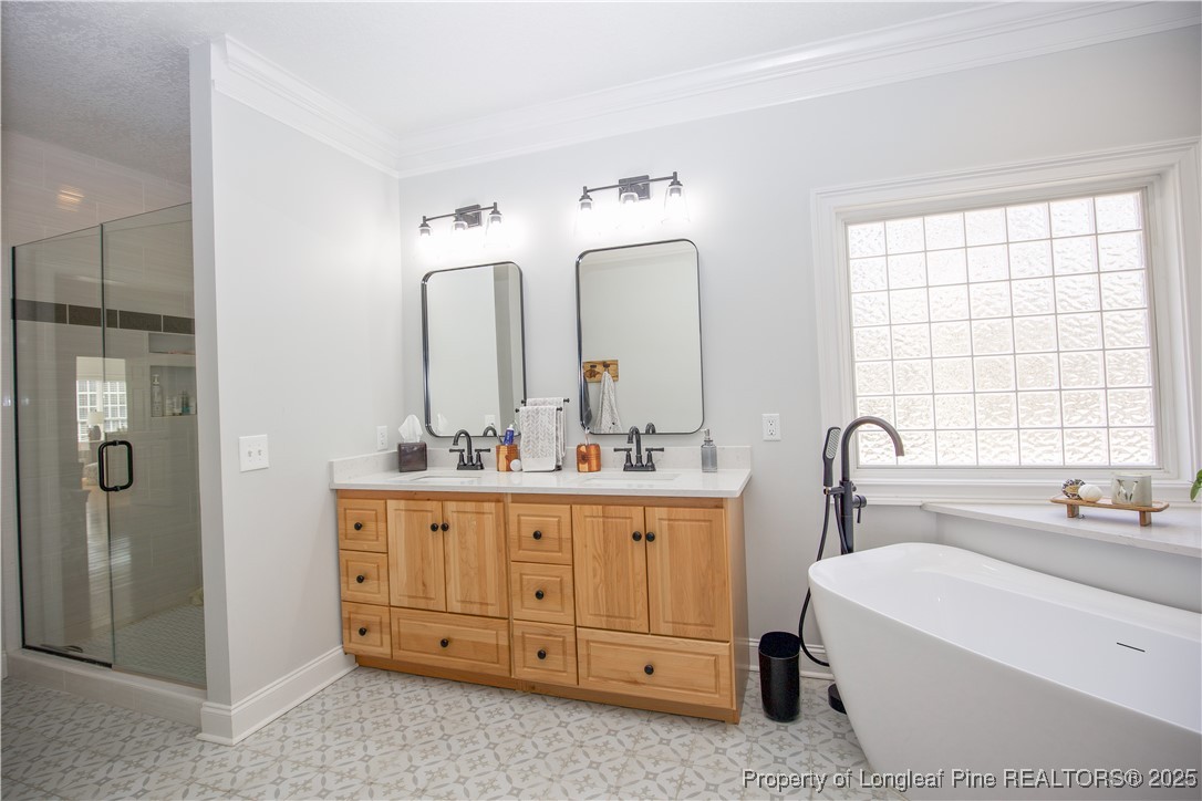 775 Connell Road Carthage, NC 28327 - Photo 22 of 50 a bathroom with a double vanity sink mirror and bathtub
