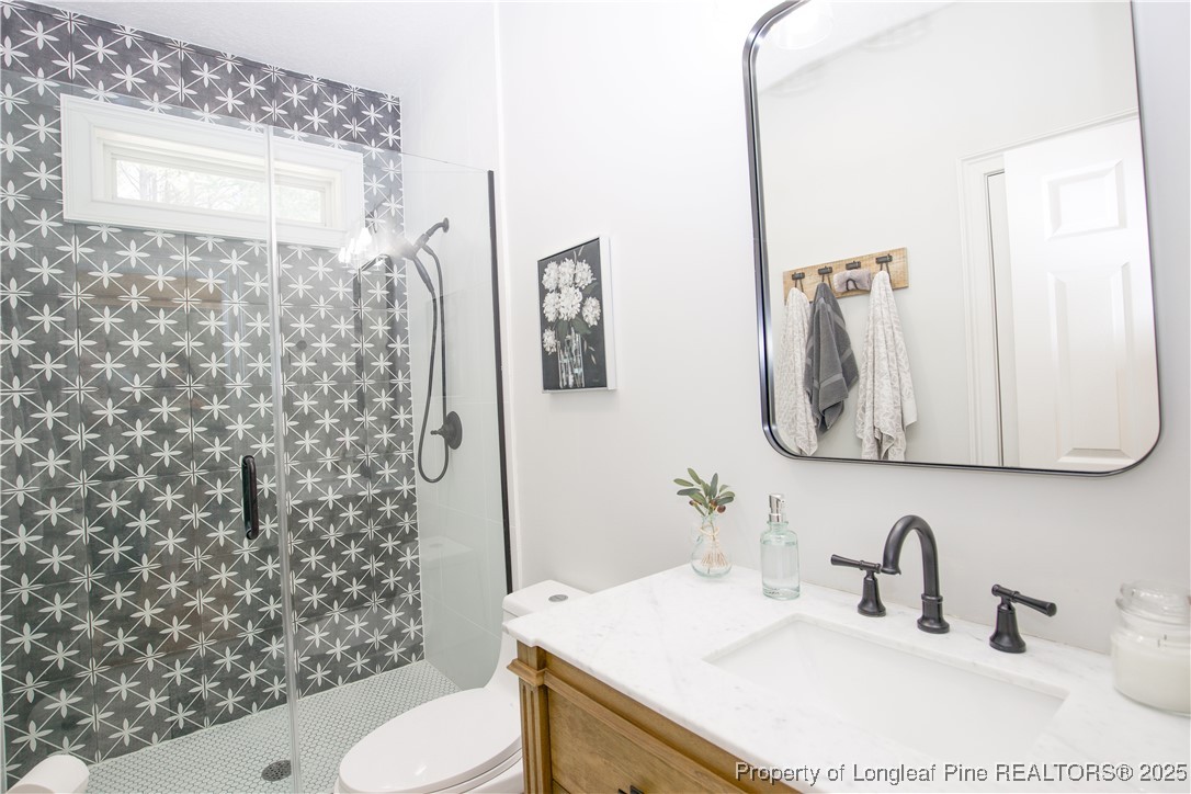 775 Connell Road Carthage, NC 28327 - Photo 23 of 50 a bathroom with a sink toilet and shower