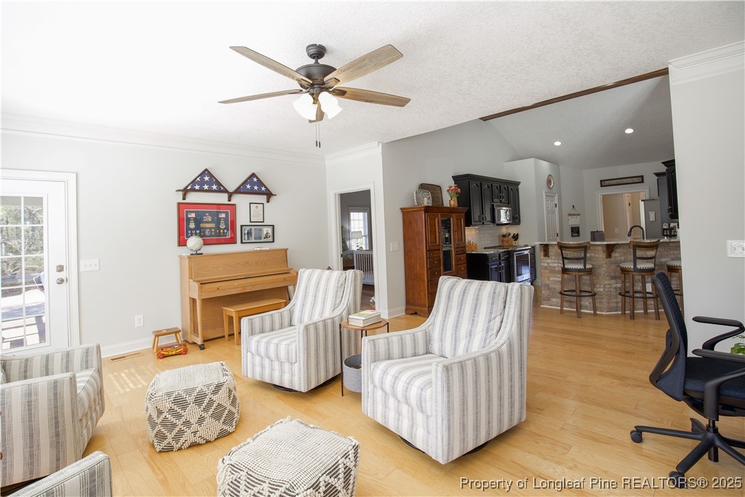 775 Connell Road Carthage, NC 28327 - Photo 24 of 50 a living room with furniture and a wooden floor