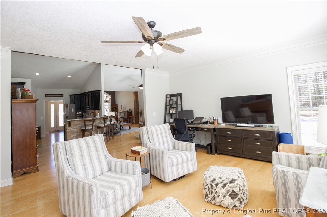 775 Connell Road Carthage, NC 28327 - Photo 26 of 50 a living room with furniture kitchen view and a flat screen tv
