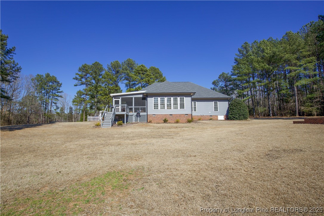 775 Connell Road Carthage, NC 28327 - Photo 33 of 50 a front view of a house with a garden and yard