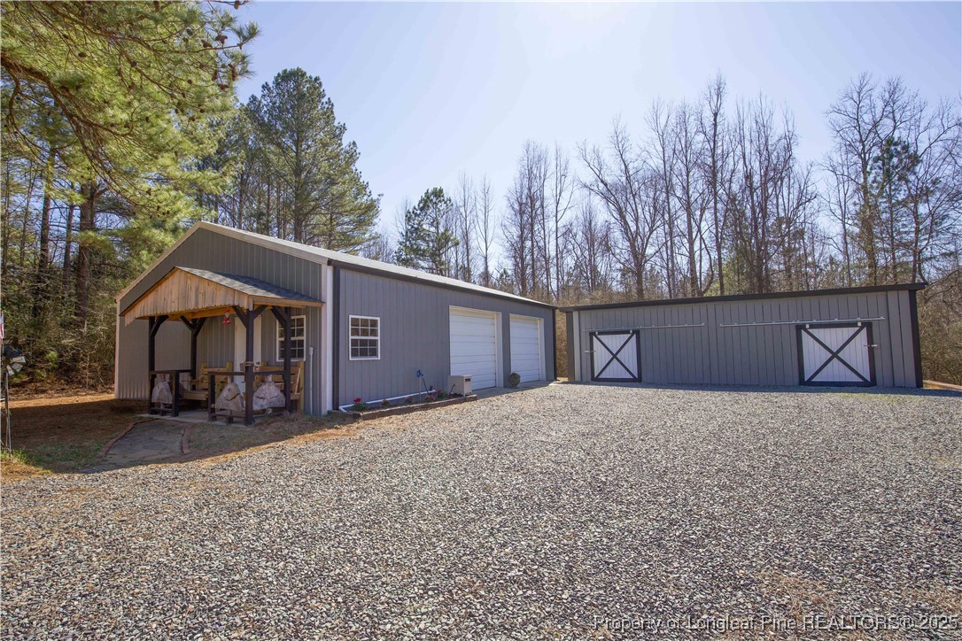 775 Connell Road Carthage, NC 28327 - Photo 36 of 50 a front view of a house with a yard
