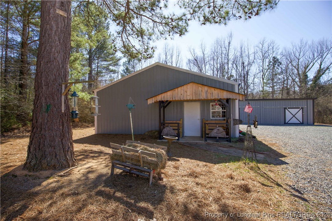 775 Connell Road Carthage, NC 28327 - Photo 37 of 50 a backyard of a house with yard fire pit and outdoor seating