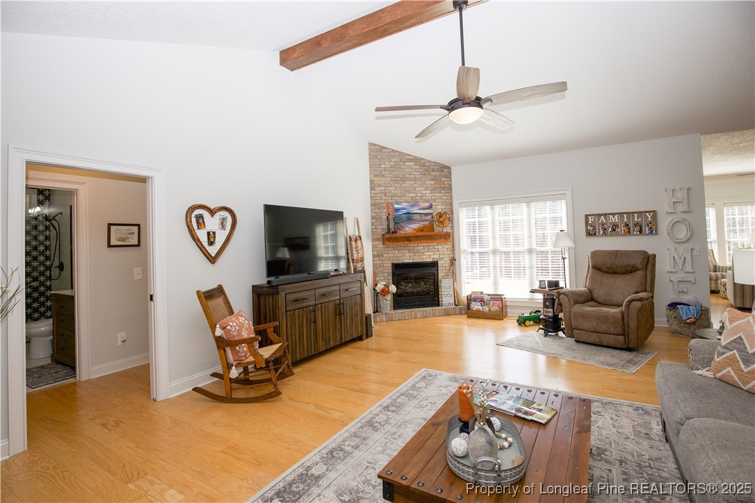 775 Connell Road Carthage, NC 28327 - Photo 6 of 50 a living room with furniture a fireplace and a flat screen tv