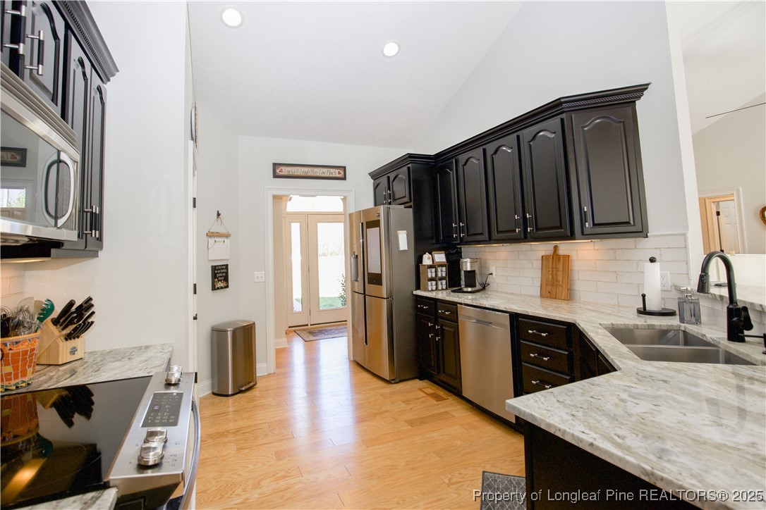 775 Connell Road Carthage, NC 28327 - Photo 10 of 50 a kitchen with stainless steel appliances granite countertop a refrigerator sink and cabinets