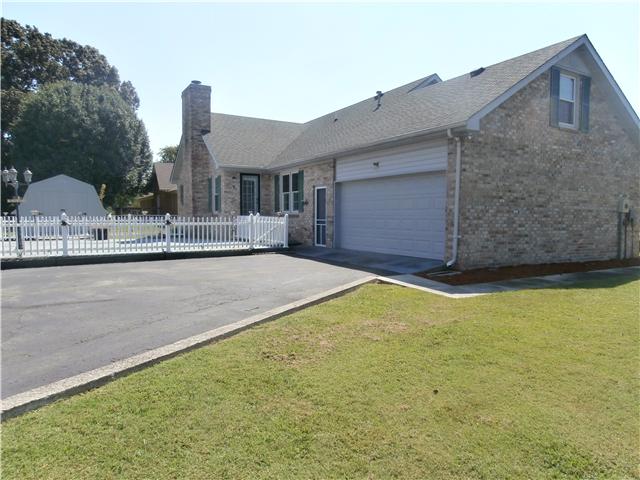 738 Doak Road Manchester, TN 37355 - Photo 5 of 13 View of back yard and 2-car garage. 2 outside storage buildings stay.