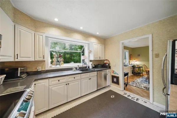 a kitchen with sink and cabinets