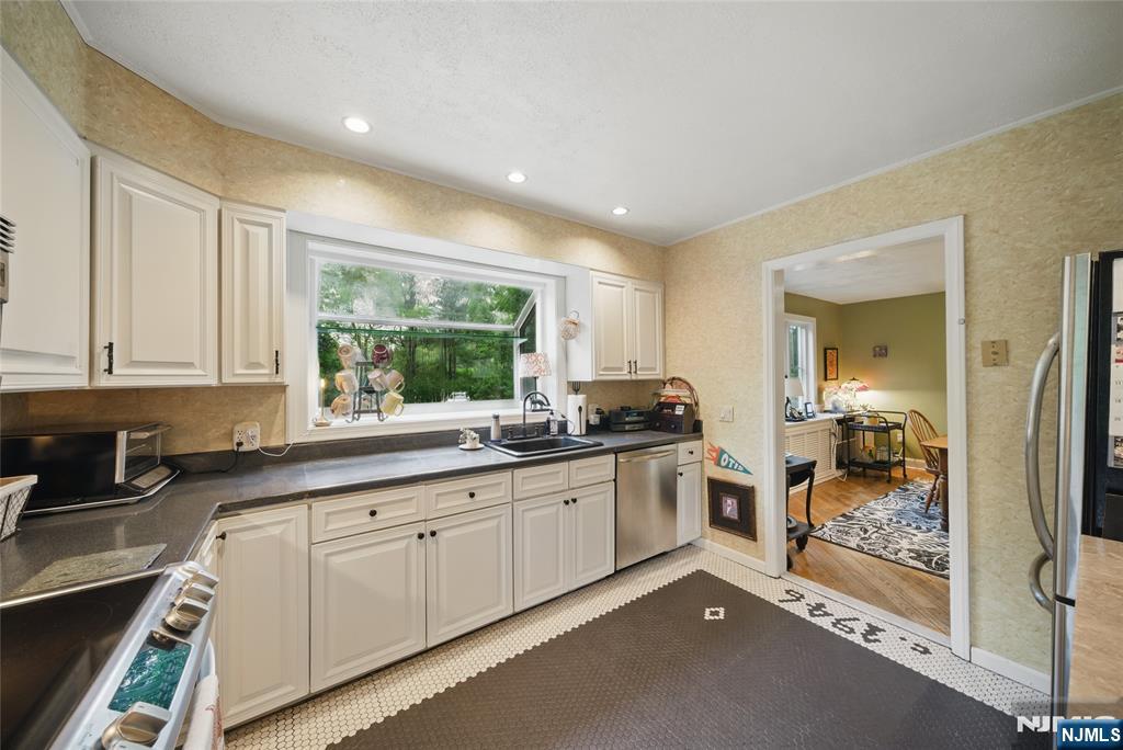 351 Franklin Road Denville, NJ 07834 - Photo 13 of 45 a kitchen with sink and cabinets
