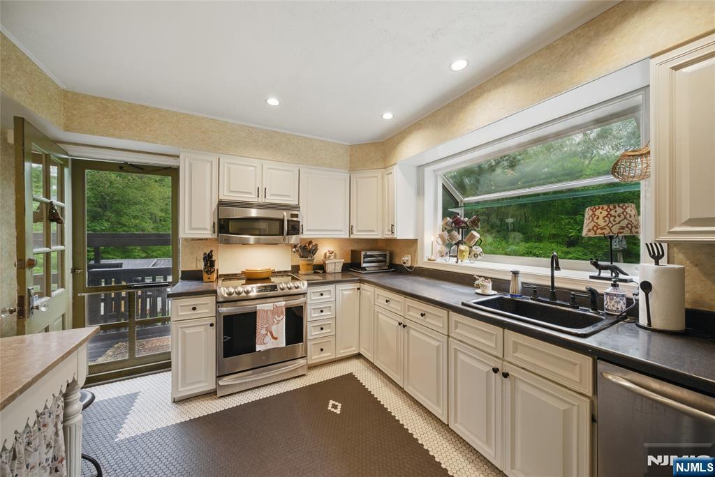 351 Franklin Road Denville, NJ 07834 - Photo 14 of 45 a kitchen with appliances a sink and cabinets