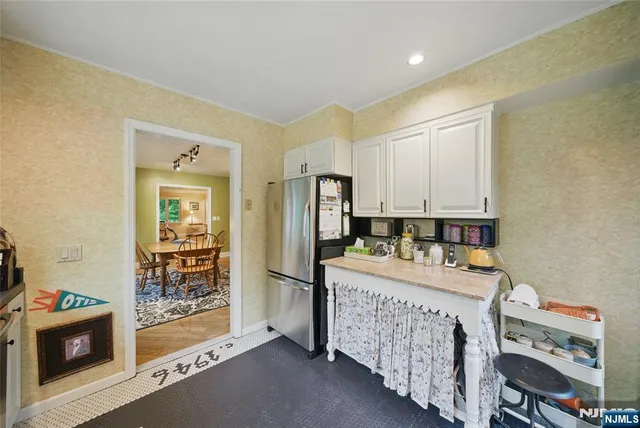 a room that has a bed and a table in it