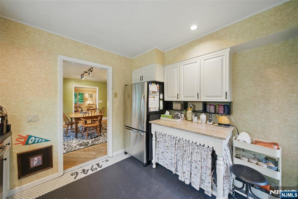 351 Franklin Road Denville, NJ 07834 - Photo 15 of 45 a room that has a bed and a table in it