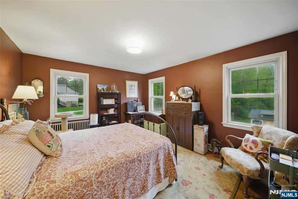 351 Franklin Road Denville, NJ 07834 - Photo 17 of 45 a bedroom with a large bed and a large window