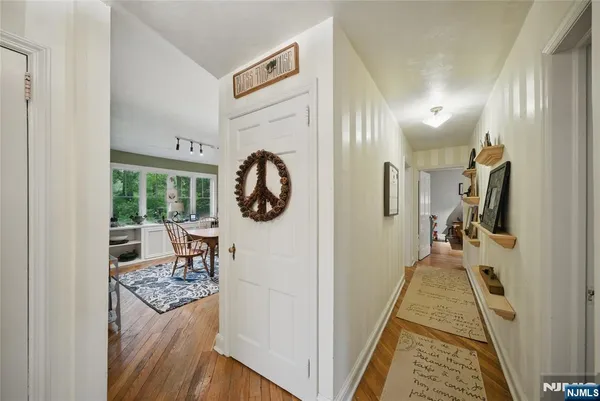 a hallway with a view of living room