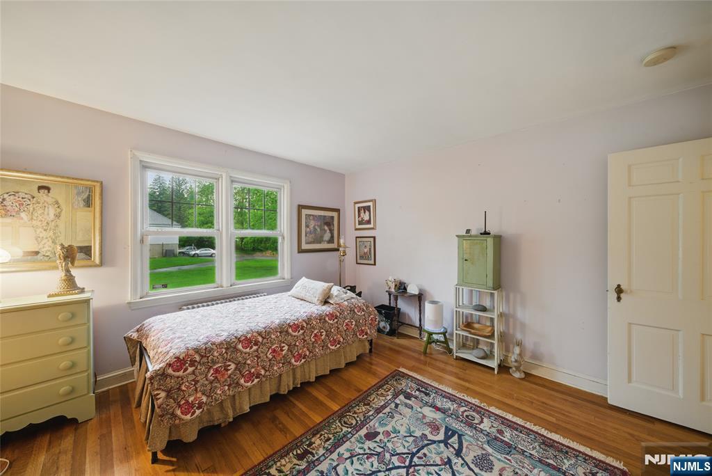 351 Franklin Road Denville, NJ 07834 - Photo 22 of 45 a bedroom with a bed and large windows