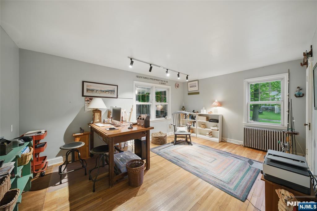 351 Franklin Road Denville, NJ 07834 - Photo 23 of 45 a view of a workspace with furniture window and wooden floor