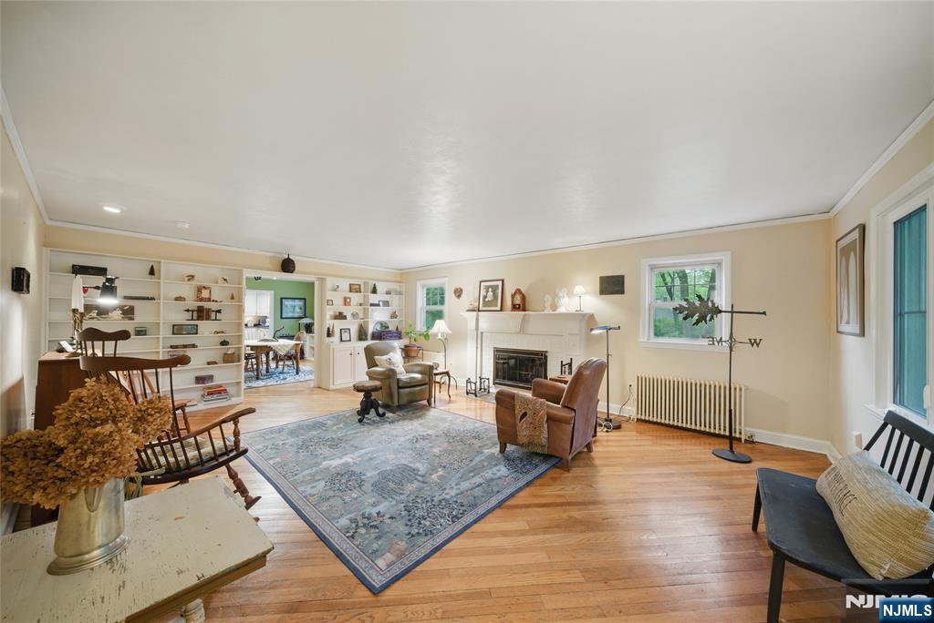 351 Franklin Road Denville, NJ 07834 - Photo 3 of 45 a living room with furniture and a fireplace