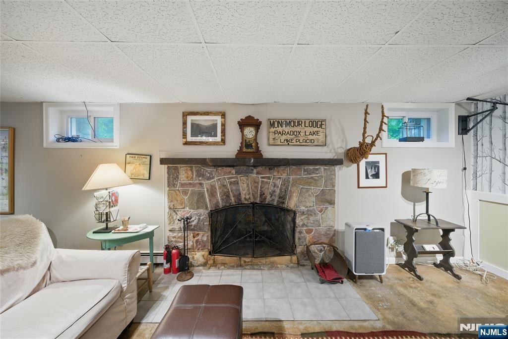 351 Franklin Road Denville, NJ 07834 - Photo 31 of 45 a living room with furniture and a fireplace