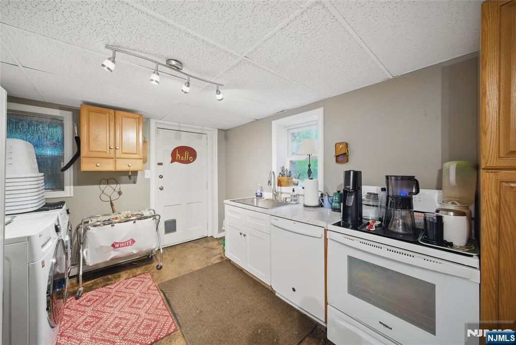 351 Franklin Road Denville, NJ 07834 - Photo 34 of 45 a kitchen with a sink stove and cabinets